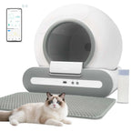 Smart pet litter box with a cat lying on the mat and a smartphone app displayed.